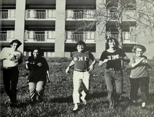 Students pose outside residence